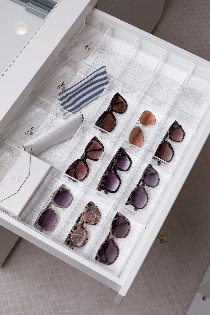 Sunglasses drawer with a clear acrylic custom-fit organizer holding space for each pair.