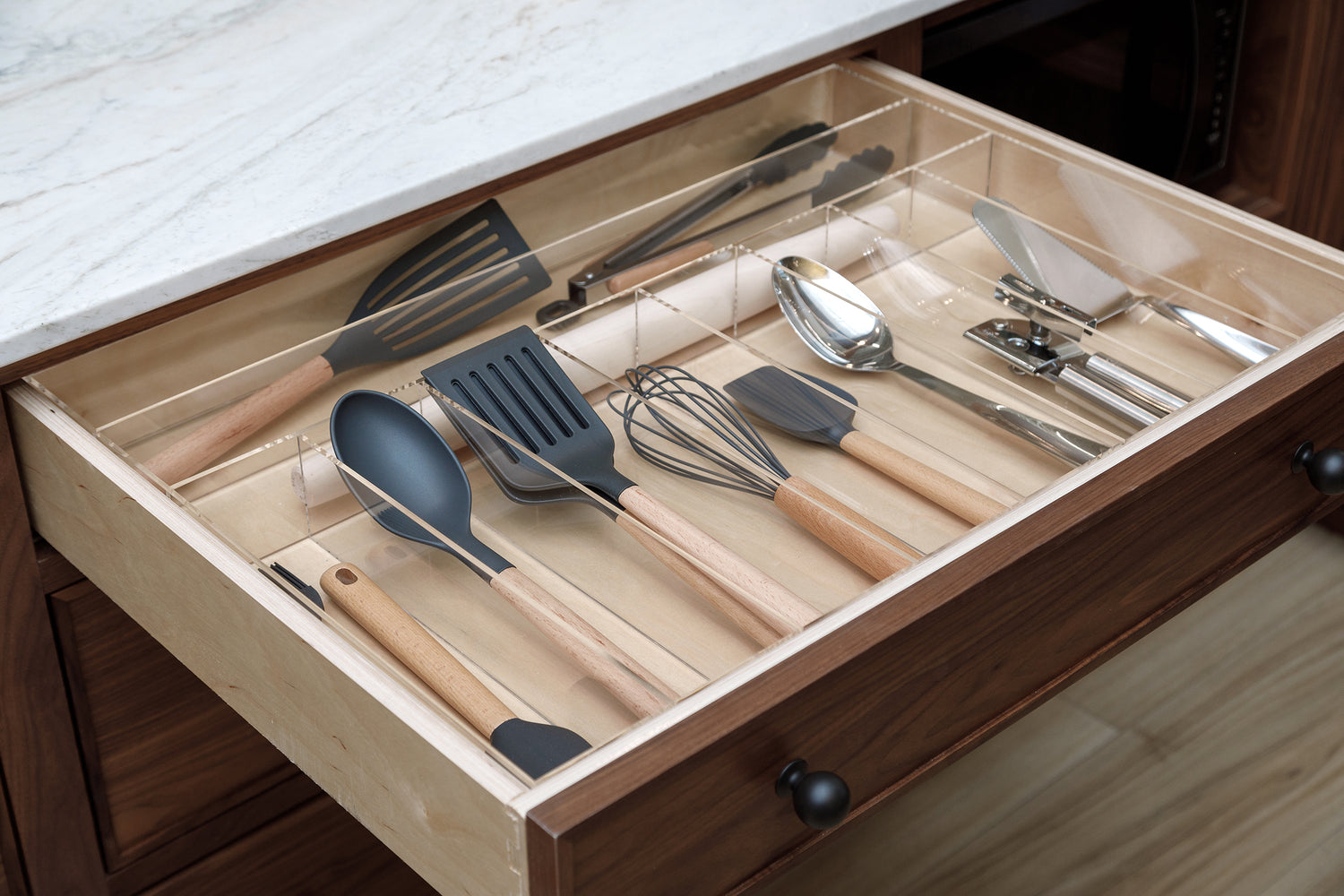 Kitchen utensils tucked neatly into a Fern custom-fit drawer organizer.