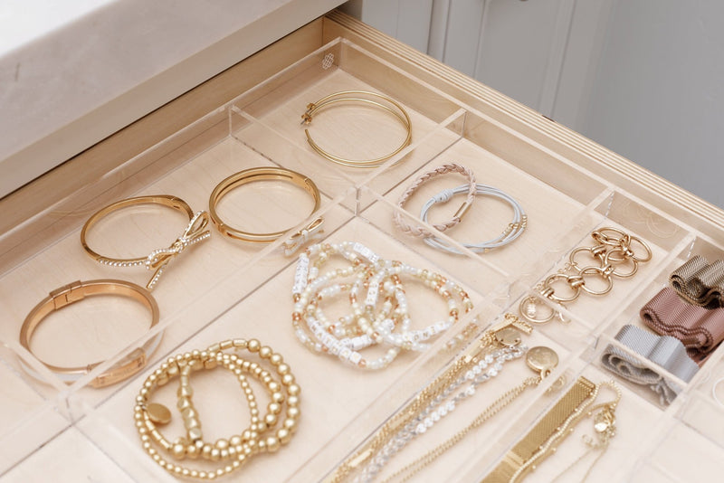 Close up view of the Scarlet custom-fit organizer filled with beautiful gold jewelry.