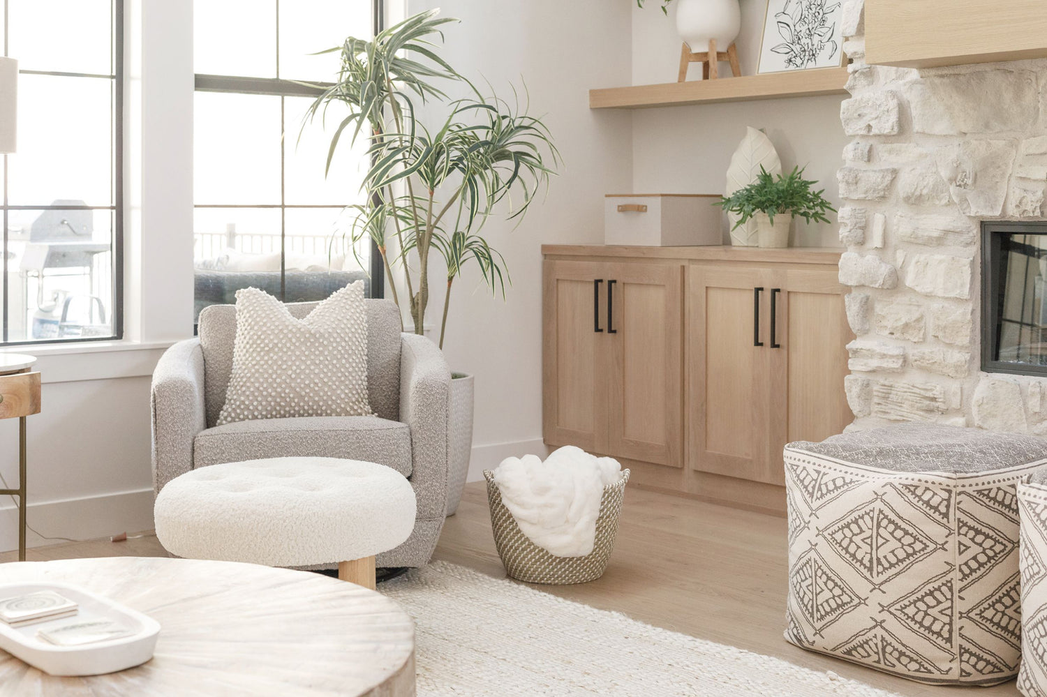 Gorgeous neutral living room with a blanket filled Bondi Beach basket and Brisbane box on the counter.