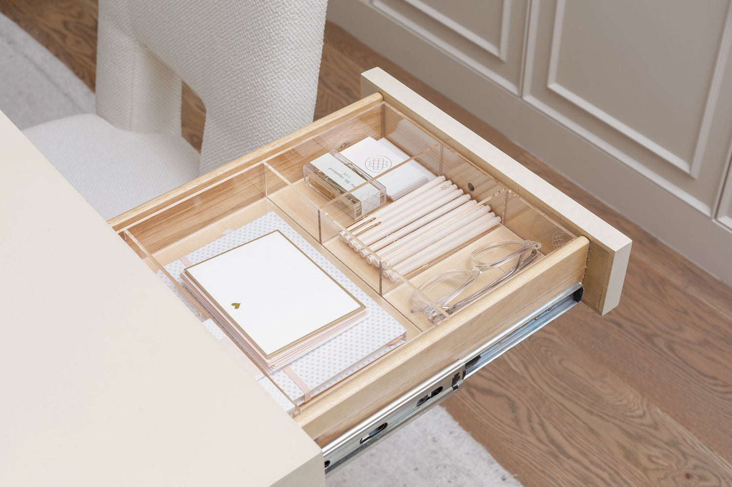 Open drawer in the office organized beautifully with a custom-fit acrylic organizer.