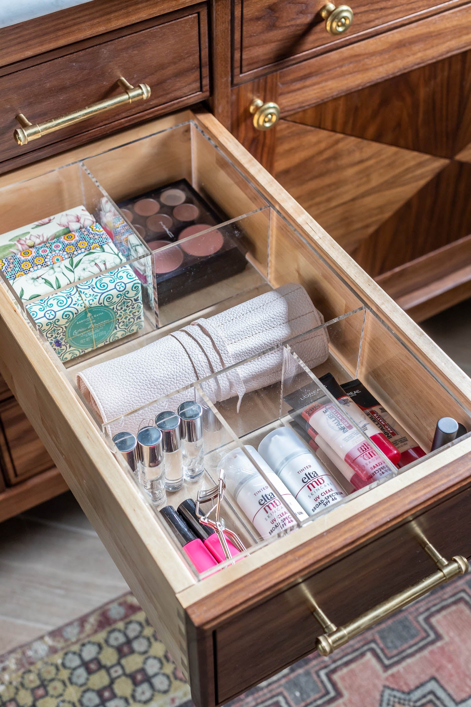 Neat and tidy make up drawer organized with a custom-fit organizer.
