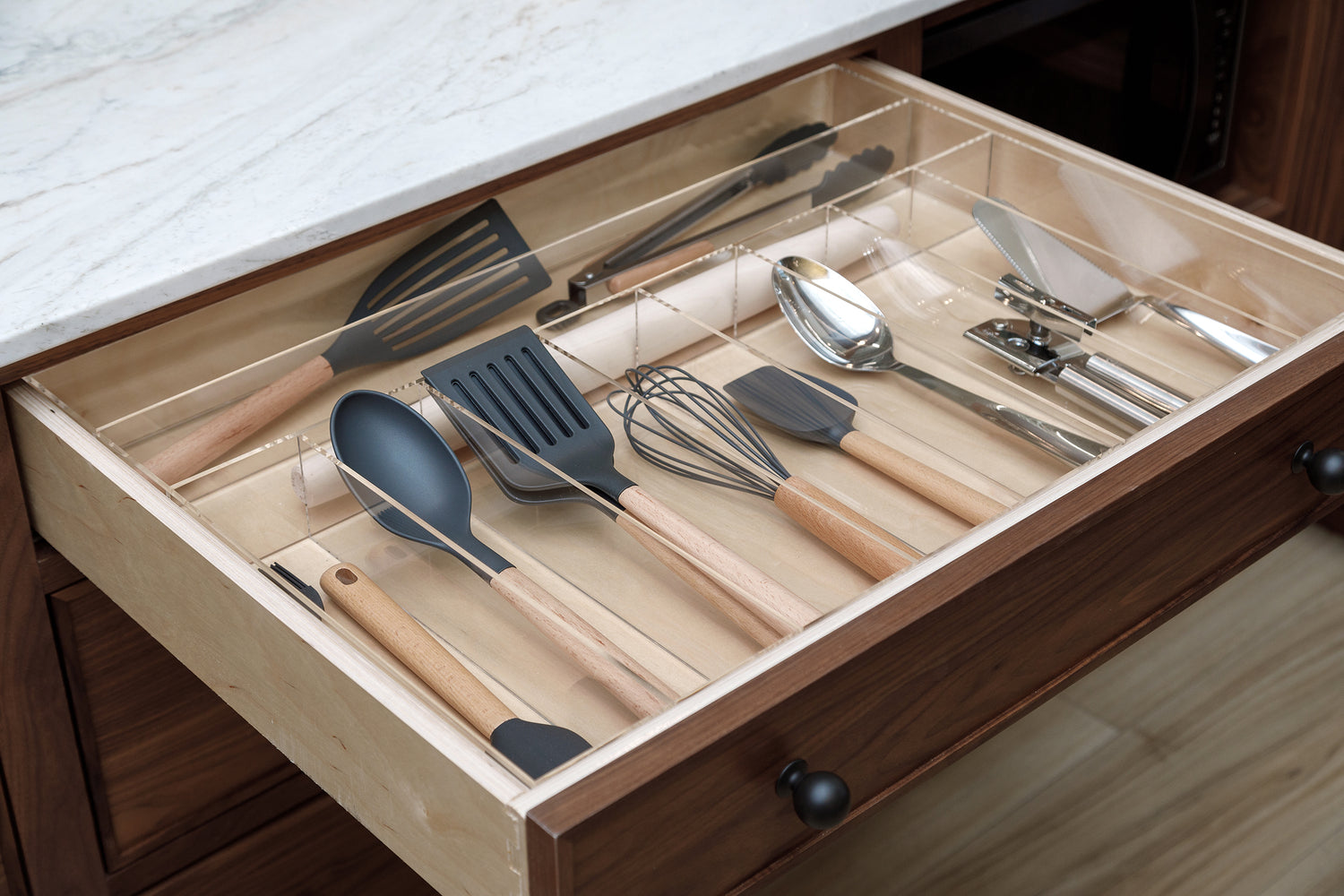 Kitchen utensils tucked neatly into a Fern custom-fit drawer organizer. 