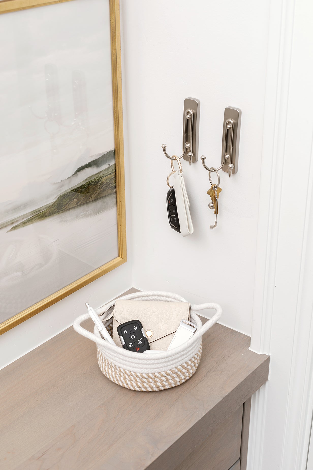 Mini Gold Coast basket on an entryway table holding a wallet and keys.