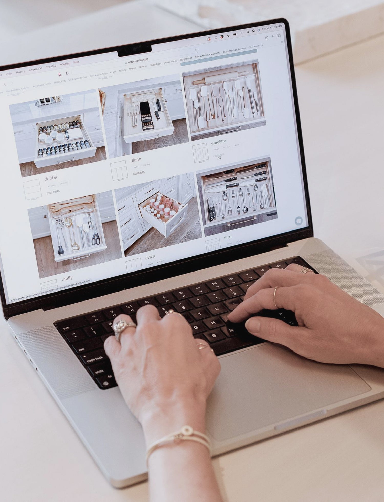 A woman viewing the Salt by Sabrina website on a laptop.