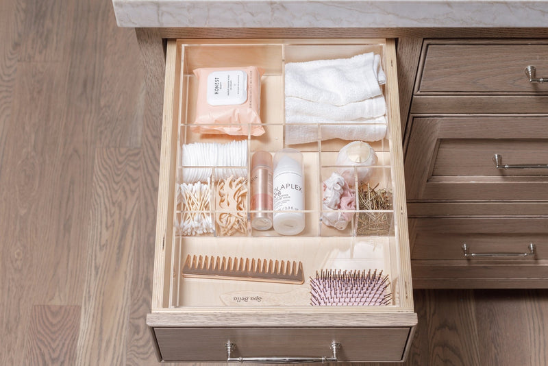 An organized bathroom drawer where each item has a place in a Mandy custom-fit organizer.