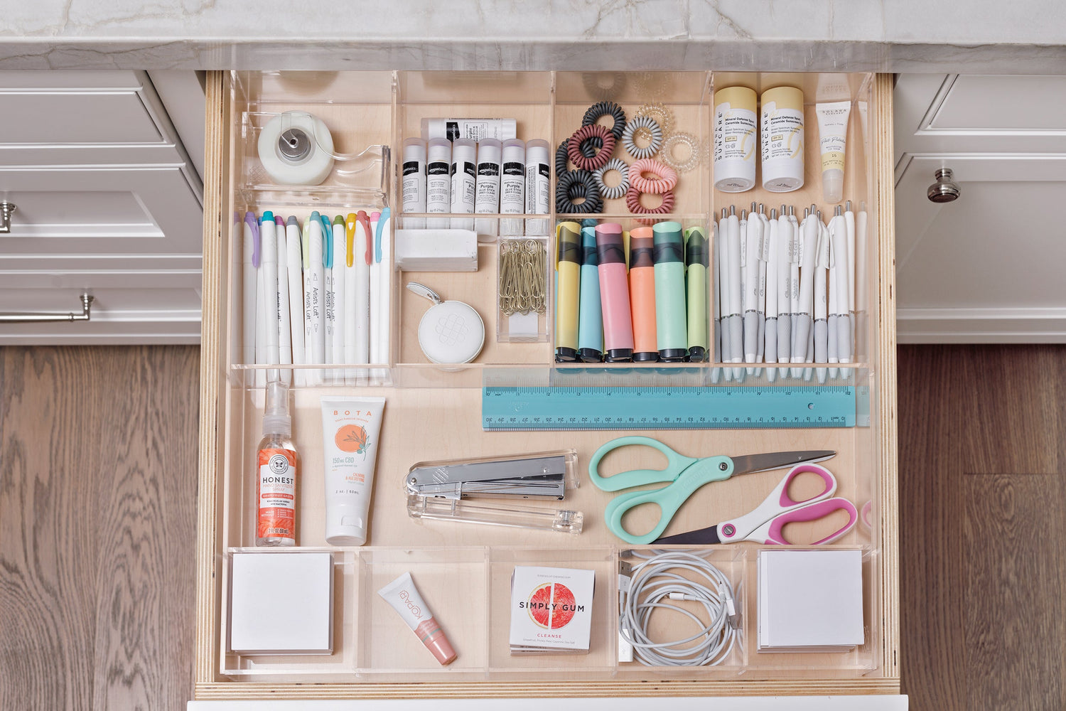 Neat and tidy office drawer using the Nathan custom-fit acrylic organizer to contain pens, cords, hair ties and other items.