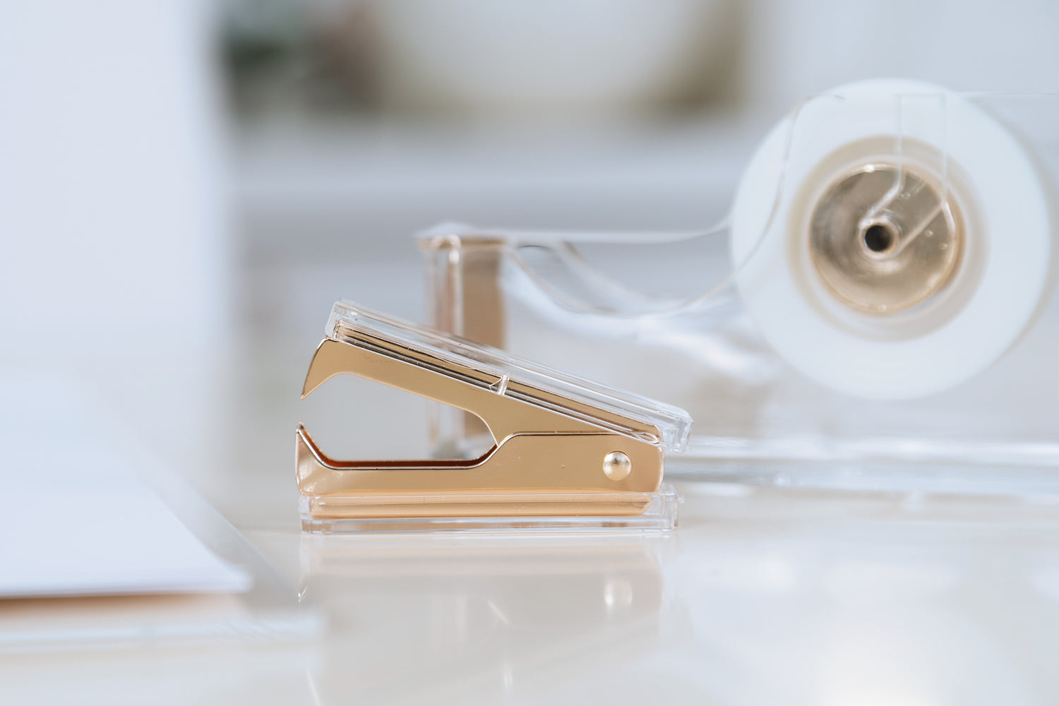 Clear view of the gold and acrylic staple remover. 