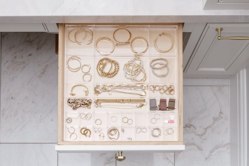 Aerial view of the Scarlet custom-fit organizer filled with beautiful gold jewelry. 