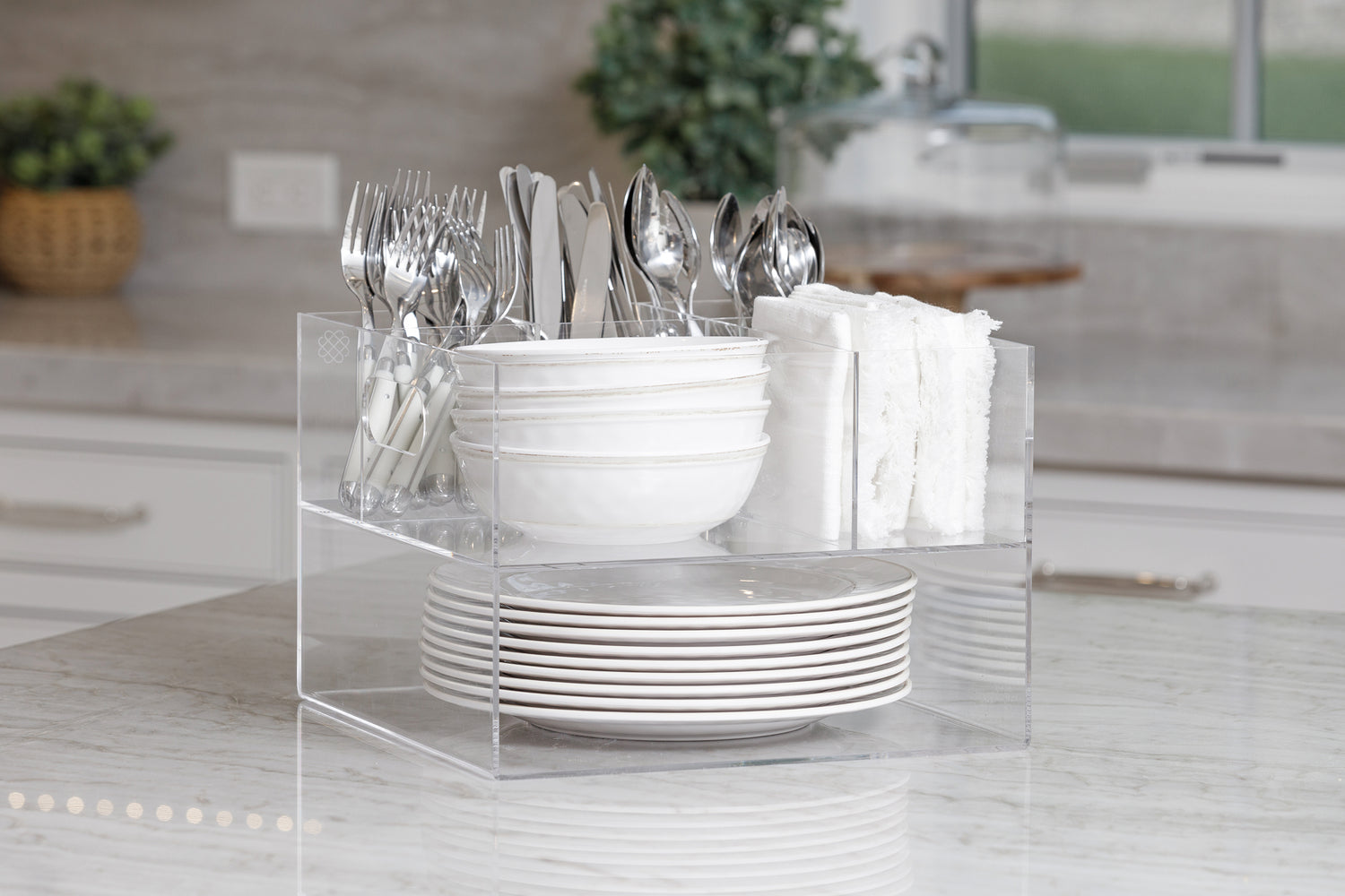 Acrylic Utensil Caddy ready for a party with white dishes, silverware, and napkins.