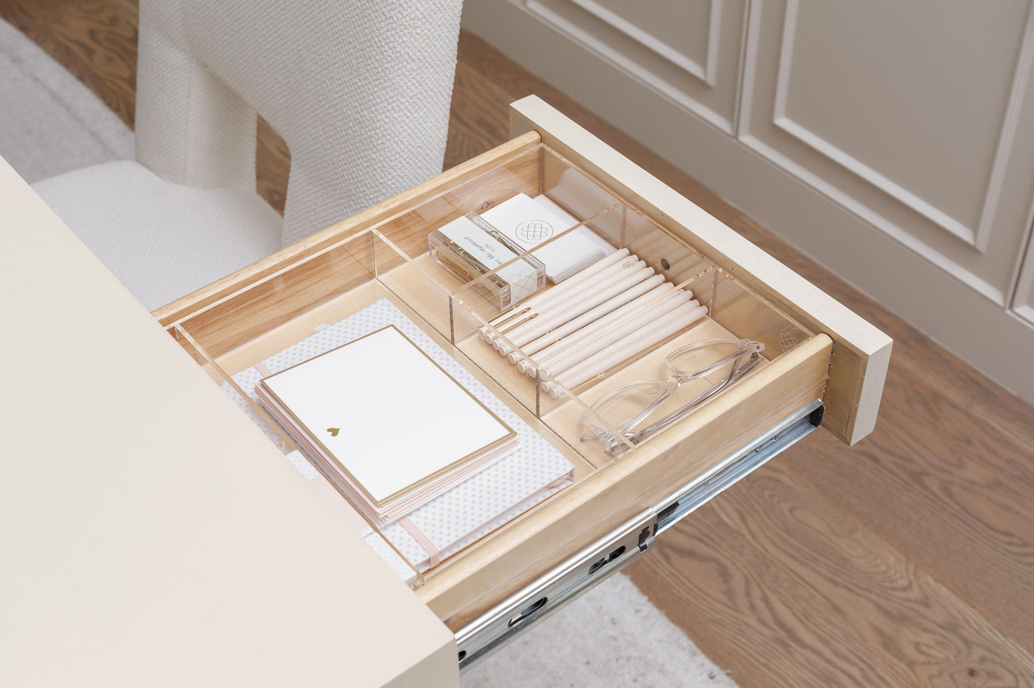 Open drawer in the office organized beautifully with a custom-fit acrylic organizer. 