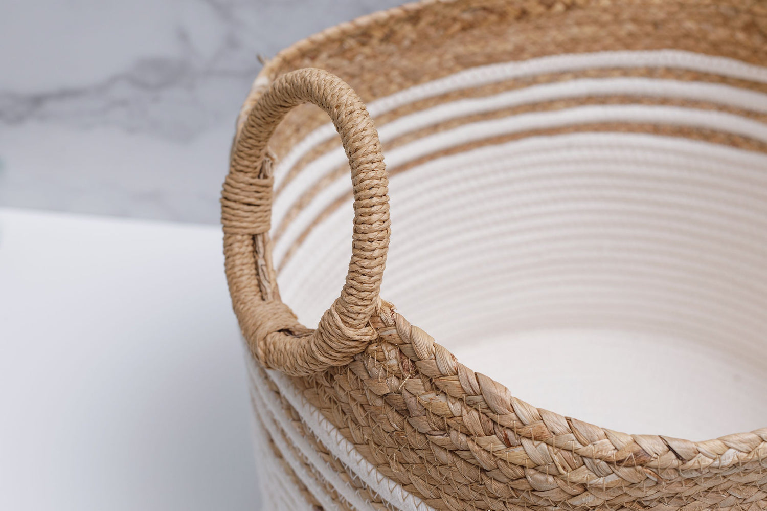 Detailed close up view of the circular handles on the Sunshine Coast basket. 